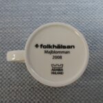 Arabia Folkhälsan Majblomman muki 0,3 l Teema malli.